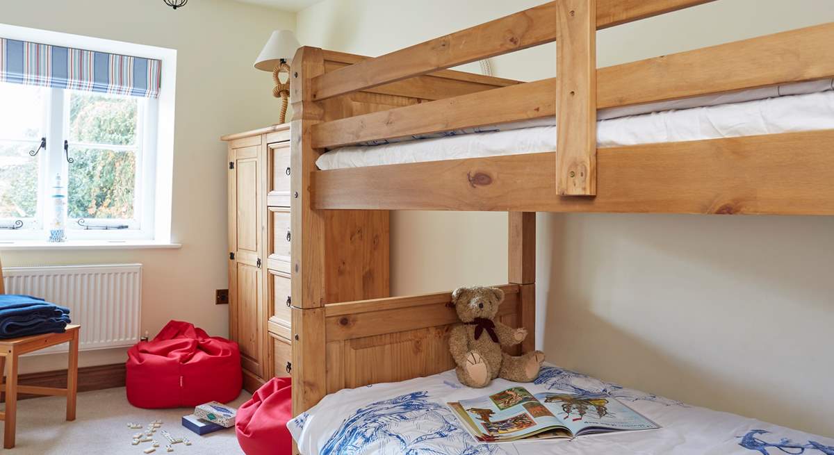 Bedroom two with bunk-beds and bright bean bags for the children.