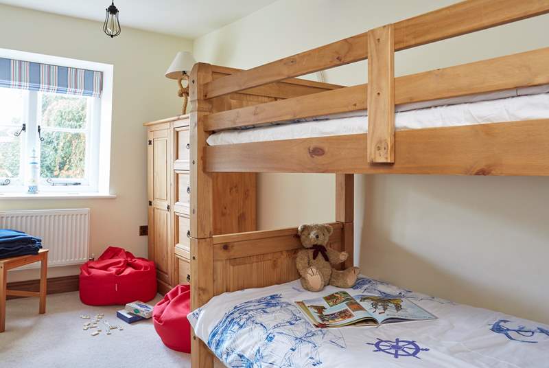 Bedroom two with bunk-beds and bright bean bags for the children.