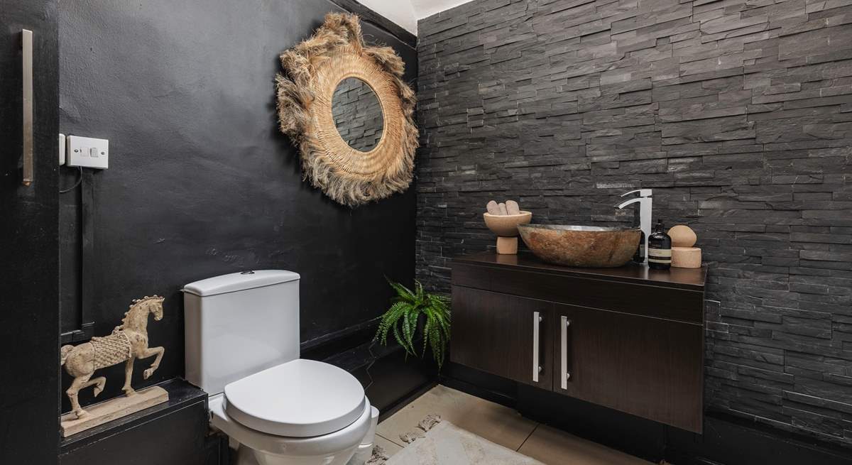 The downstairs cloakroom with its beautiful slate tiles and adornments.