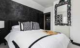 Another fabulous bedroom continues the monochrome design. - Thumbnail Image