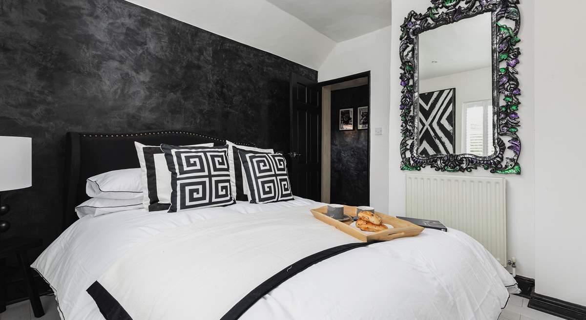 Another fabulous bedroom continues the monochrome design.