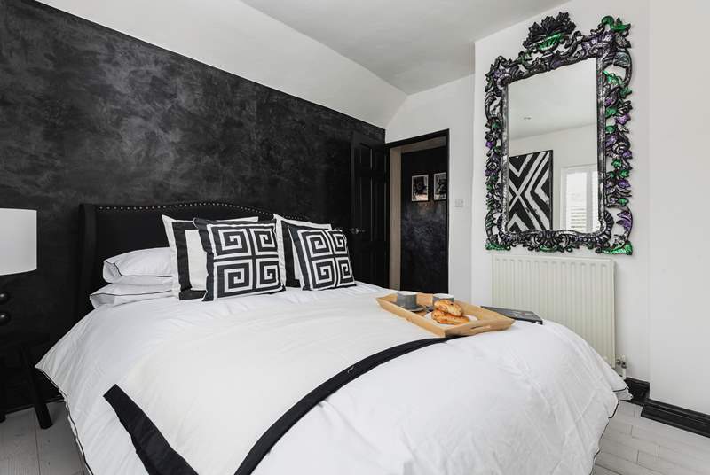 Another fabulous bedroom continues the monochrome design.