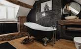 The en suite to the main bedroom has an elegant roll-top bath and stunning interior design. - Thumbnail Image