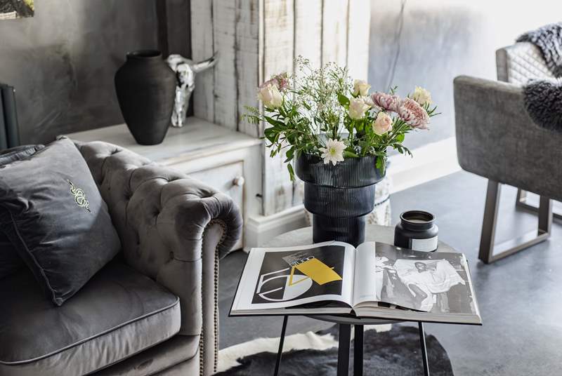 Enjoy one of the many beautiful art and fashion books in this comfy velvet armchair.