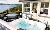 Relax in the blissful hot tub and soak up the views.  - Thumbnail Image