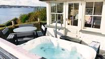 Relax in the blissful hot tub and soak up the views. 