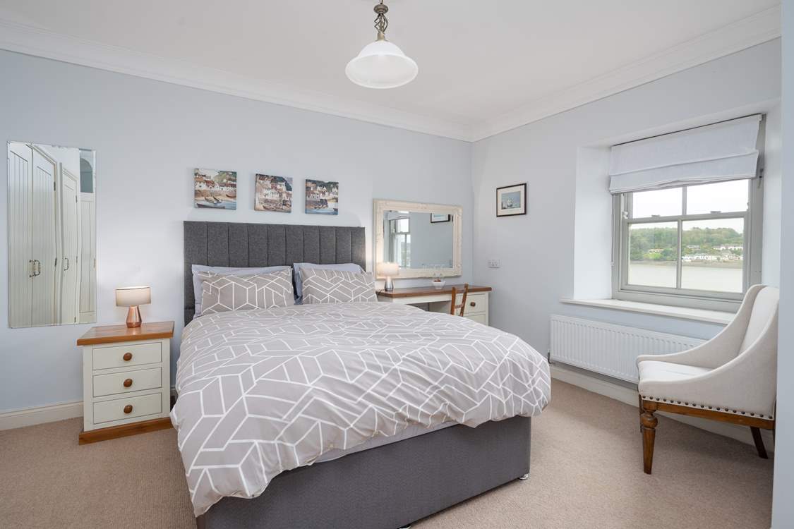 En suite double room with a waterway view.