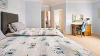 Well appointed en suite twin room with wonderful waterway views. These beds may be pushed together to make a double bed (please let us know when booking if you would like this). 
