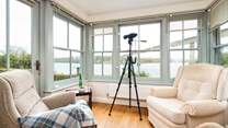 The sun-room is the perfect spot for watching the boats sail by. 