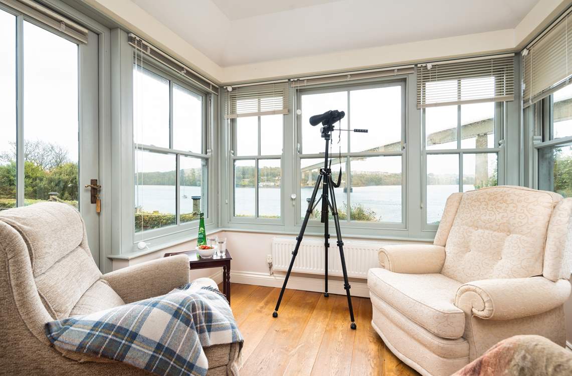 The sun-room is the perfect spot for watching the boats sail by.