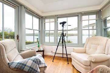 The sun-room is the perfect spot for watching the boats sail by.
