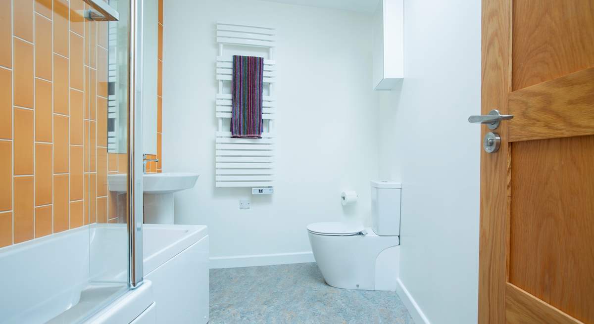 The modern family bathroom with lovely bright tiles.