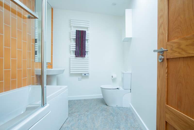 The modern family bathroom with lovely bright tiles.