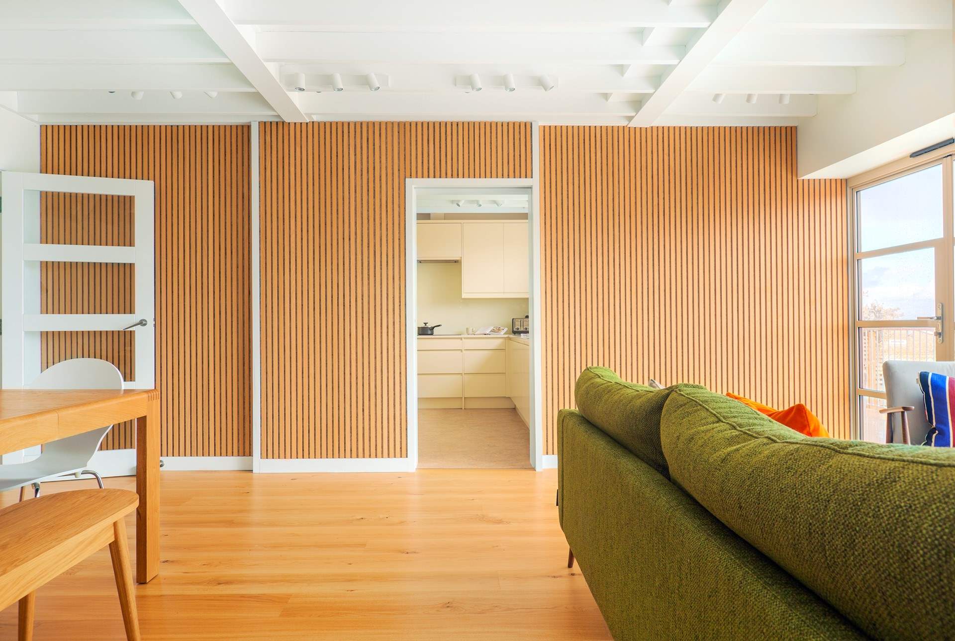 Stylish sitting/dining-room through to the kitchen.