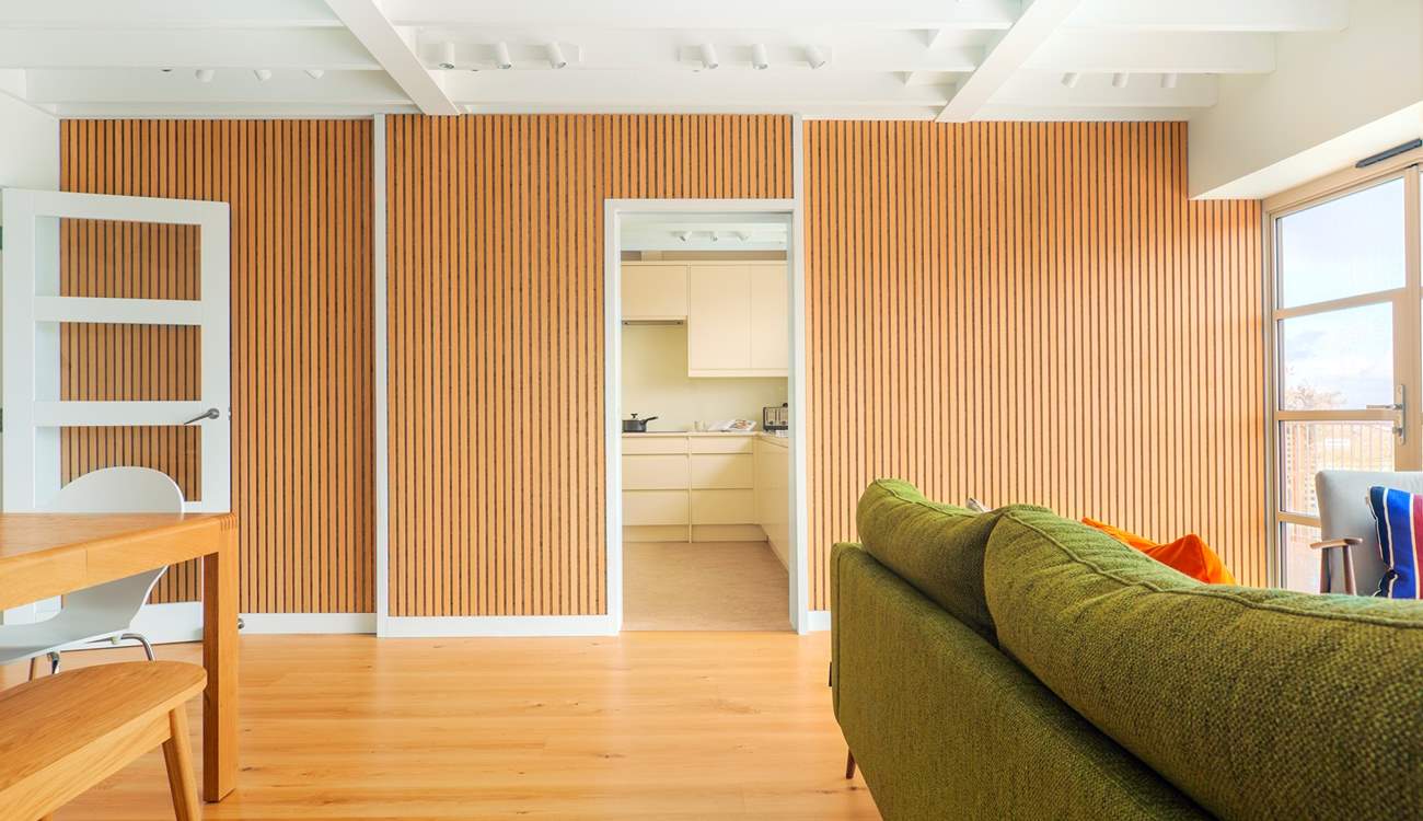 Stylish sitting/dining-room through to the kitchen.