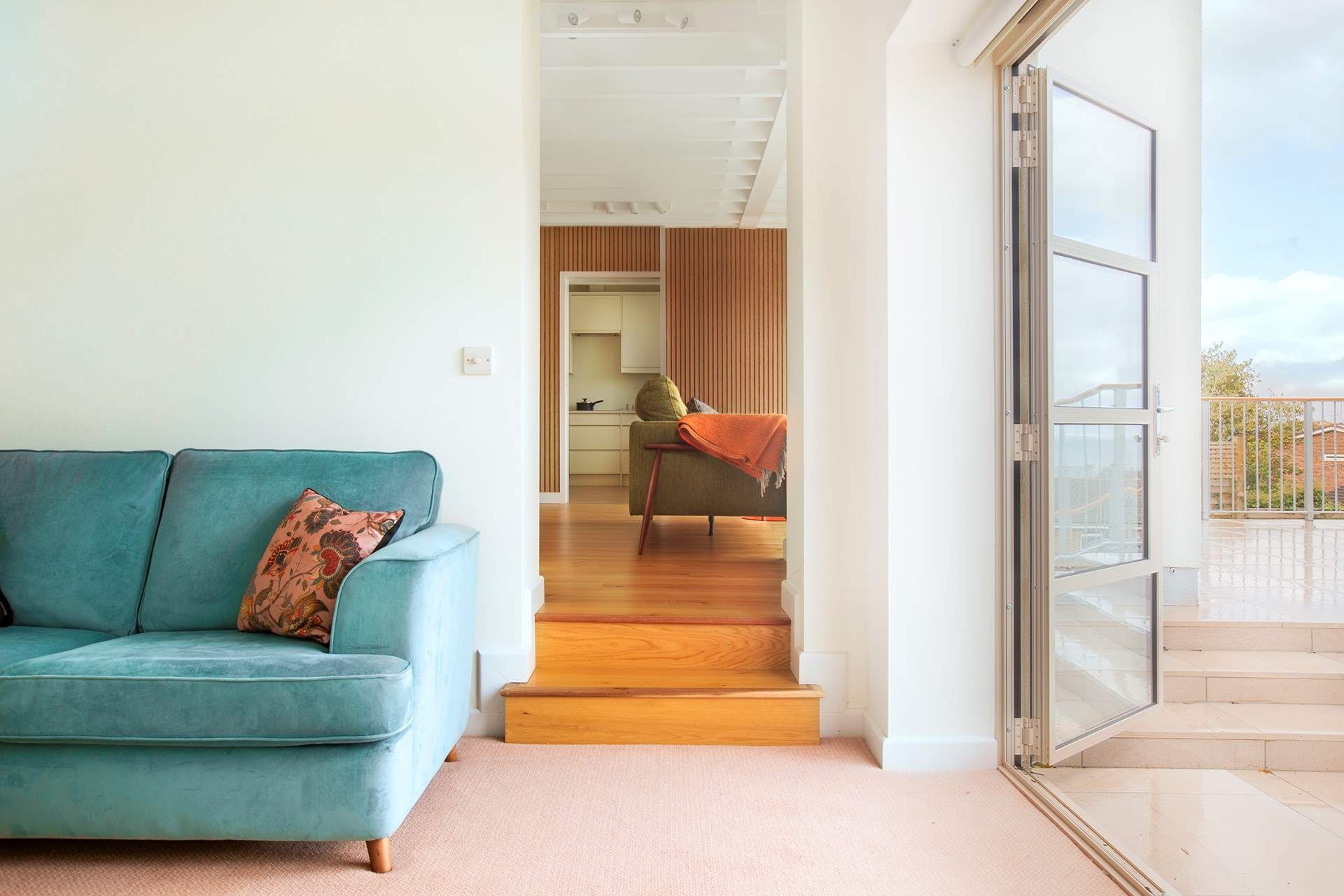 The snug with doors to access the balcony area.