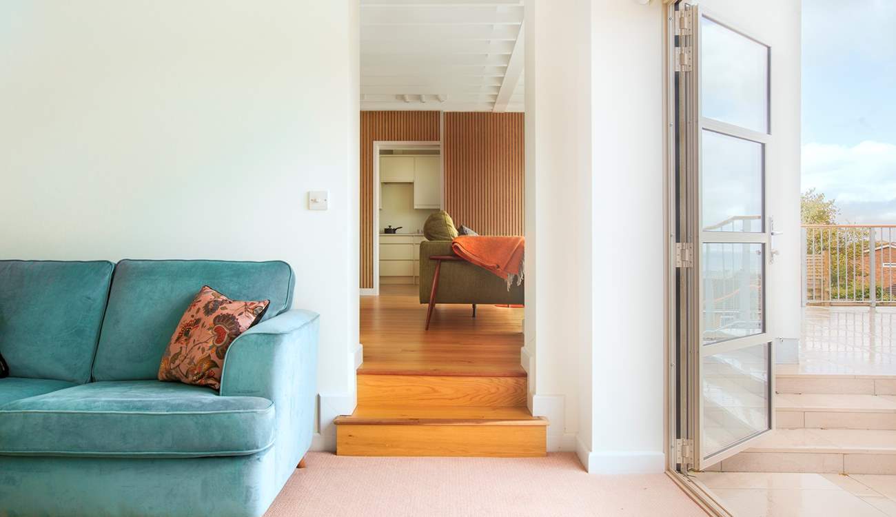 The snug with doors to access the balcony area.