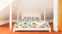 The super-king size bed in the main bedroom on the first floor.