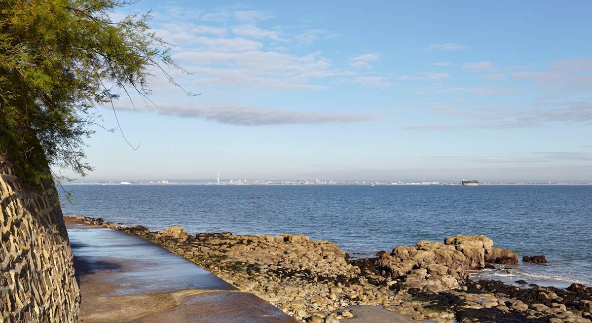 Footpath along the waters edge at Seaview with view of Portsmouth in the distance.