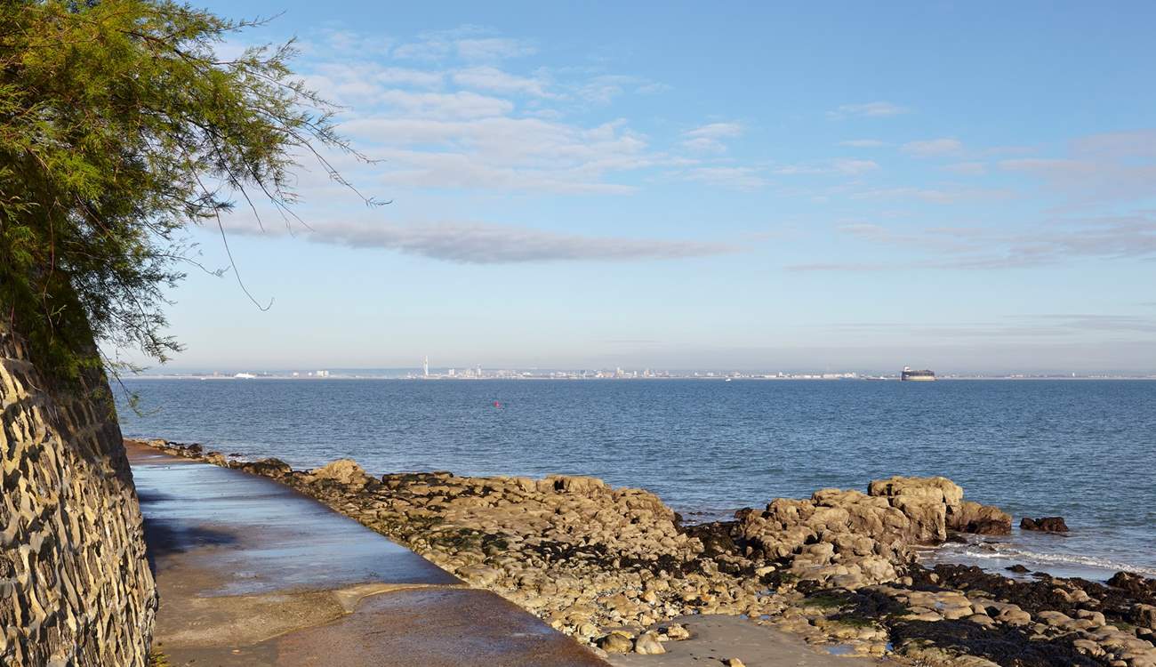 Footpath along the waters edge at Seaview with view of Portsmouth in the distance.
