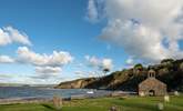 Walk to Cwm yr Eglws at low tide or follow the coast path, a sheltered cove with a sandy beach and rock pools. What remains of St. Brynach's Church after the Great Storm still stand on the beach front.  - Thumbnail Image