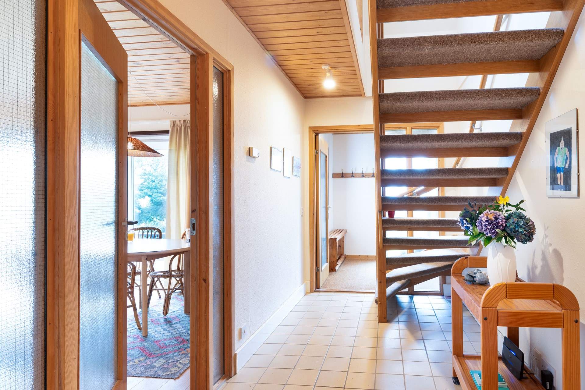 Climb the open tread staircase to the two further bedrooms, shower-room and very useful second sitting-room/snug where you'll find a TV, lots of games and a table and chairs. Children will love this space.