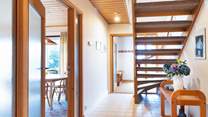 Climb the open tread staircase to the two further bedrooms, shower-room and very useful second sitting-room/snug where you'll find a TV, lots of games and a table and chairs. Children will love this space.