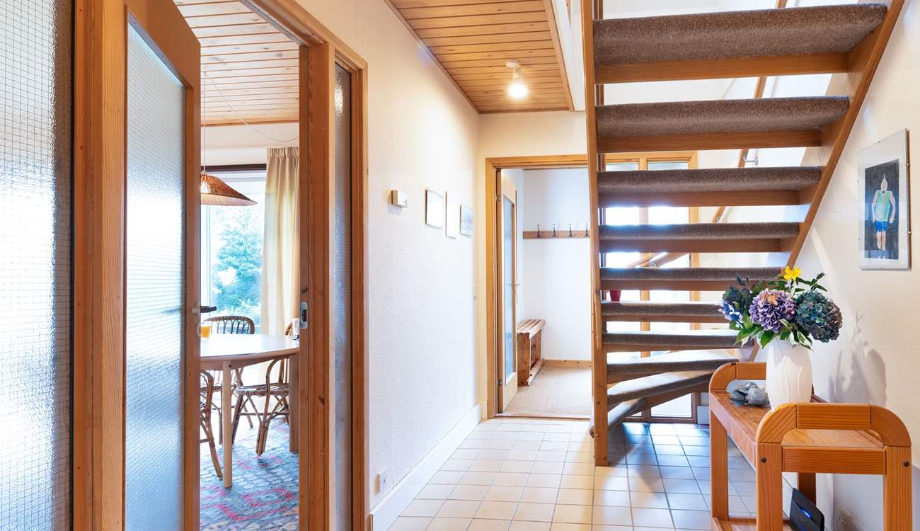 Climb the open tread staircase to the two further bedrooms, shower-room and very useful second sitting-room/snug where you'll find a TV, lots of games and a table and chairs. Children will love this space.