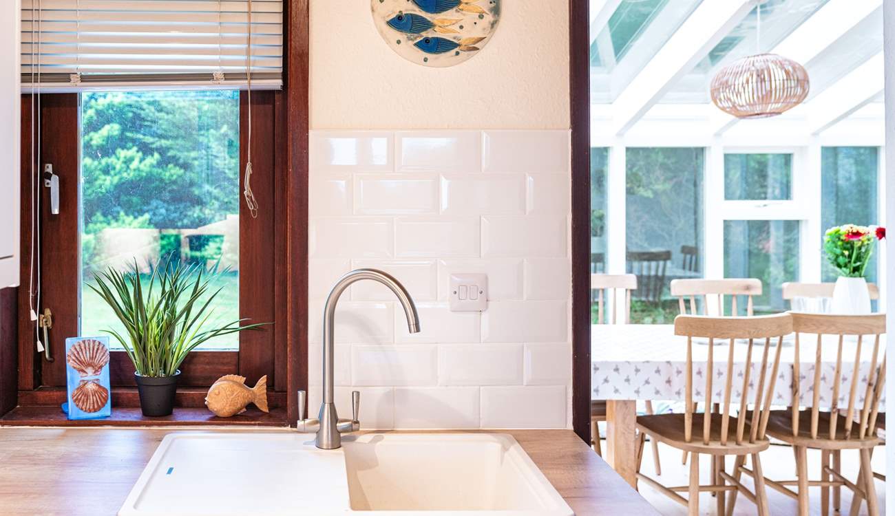 Just off the kitchen is the delightful sun-room.