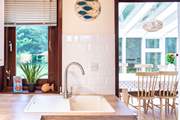 Just off the kitchen is the delightful sun-room.