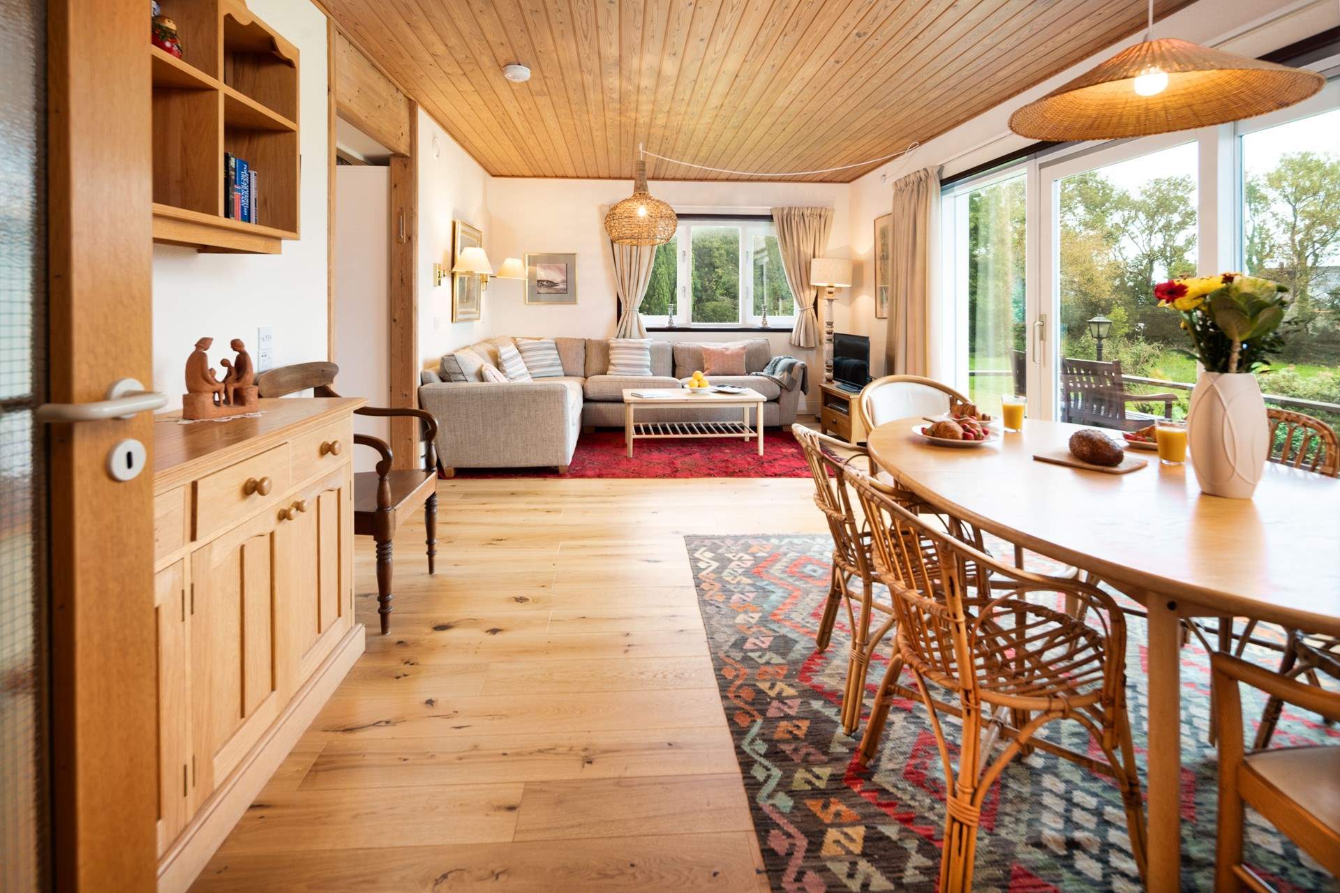 Commanding an enchanting position with sea views, the versatile accommodation sleeps eight over two floors. 