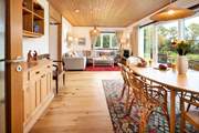 Commanding an enchanting position with sea views, the versatile accommodation sleeps eight over two floors.