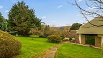 Step out of your front door with swimmers in hand and head over to your enclosed pool area (you can see a glimpse of the pool just left of the image through the hedge surround).