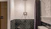 For those who prefer a shower, the family bathroom offers a beautiful shower space.