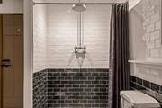 For those who prefer a shower, the family bathroom offers a beautiful shower space.