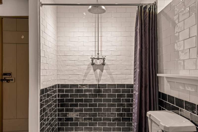 For those who prefer a shower, the family bathroom offers a beautiful shower space.
