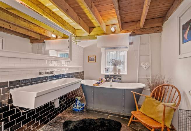 The family bathroom is also fully equipped with a fabulous roll-top tub. 