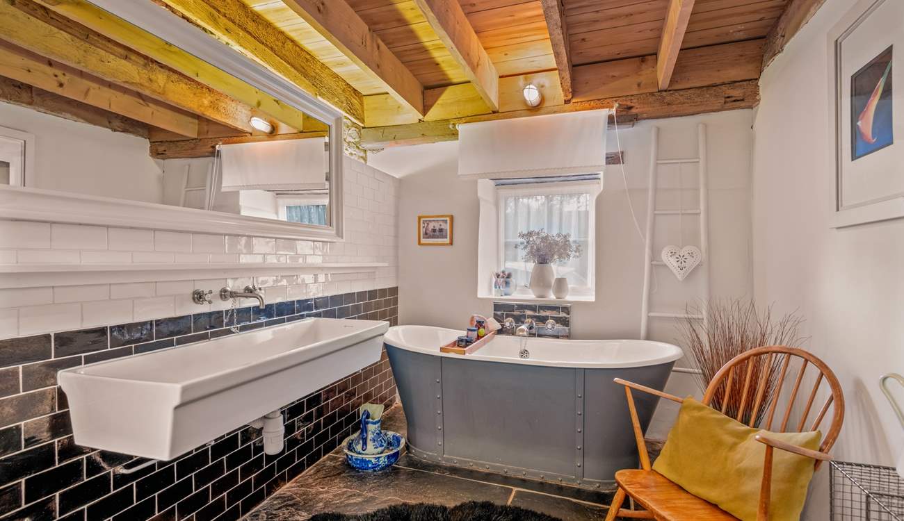 The family bathroom is also fully equipped with a fabulous roll-top tub. 