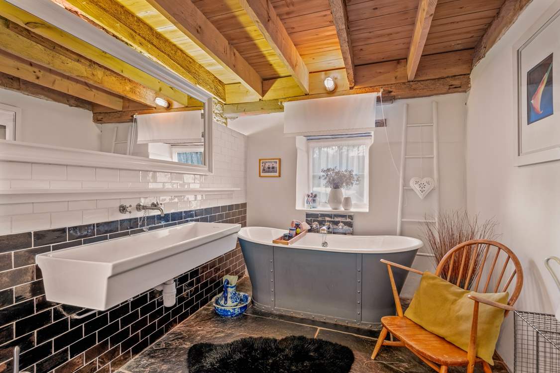 The family bathroom is also fully equipped with a fabulous roll-top tub.