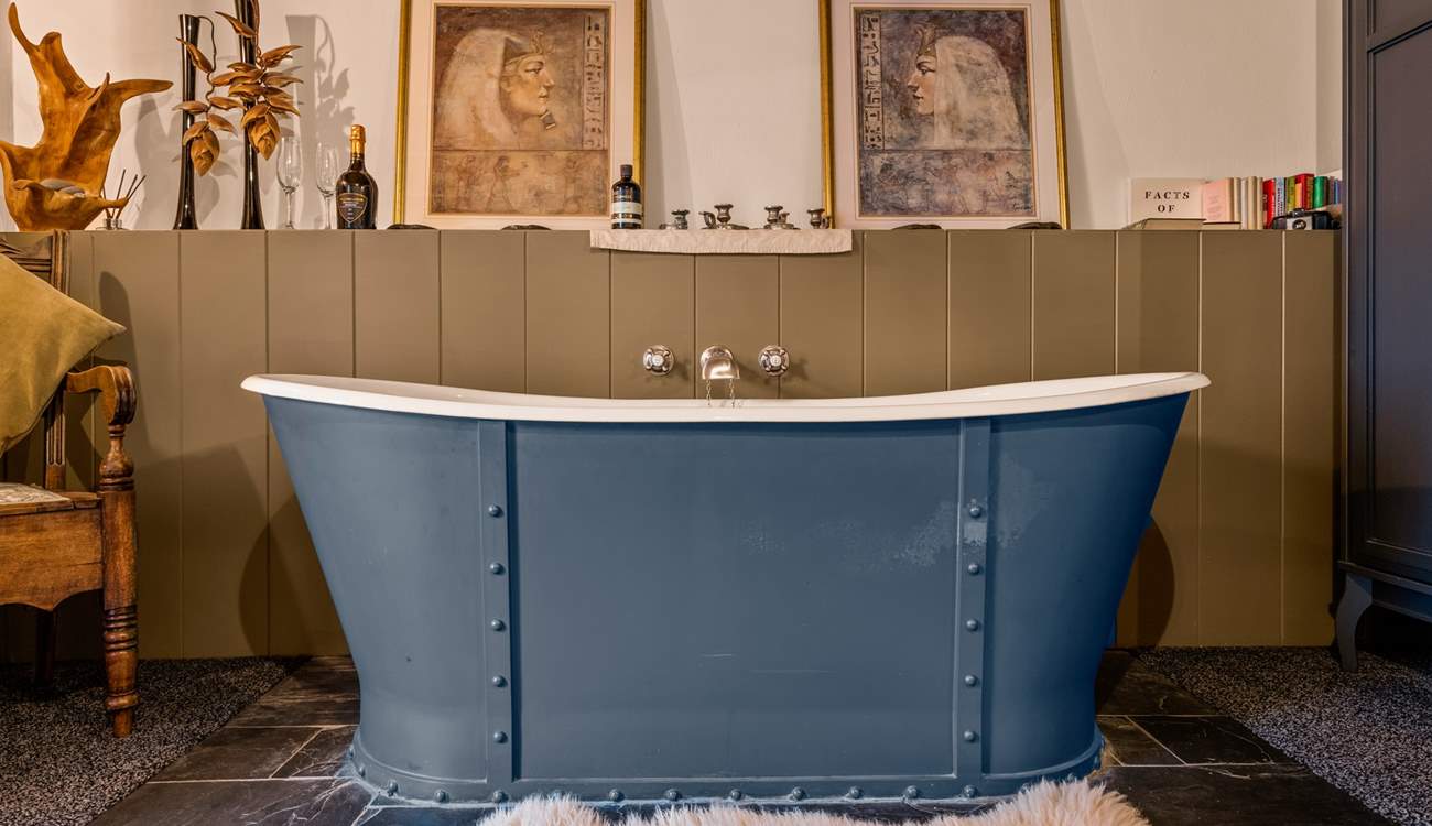 Jump out of bed, straight into your roll-top bath which sits proudly at the foot of your bed.