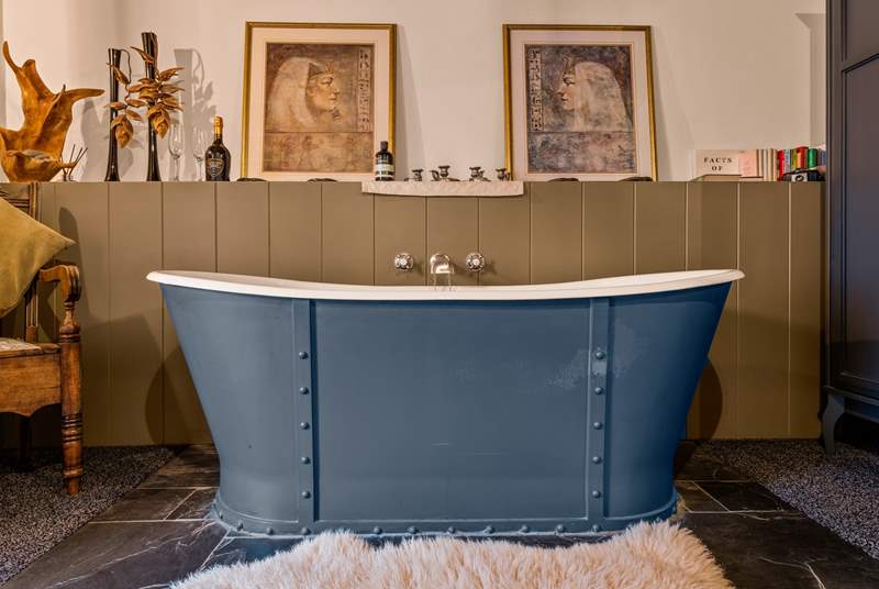 Jump out of bed, straight into your roll-top bath which sits proudly at the foot of your bed.