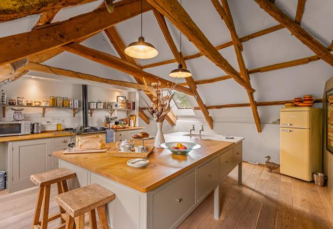 The fully equipped kitchen is such a light and spacious space to prepare any meal.