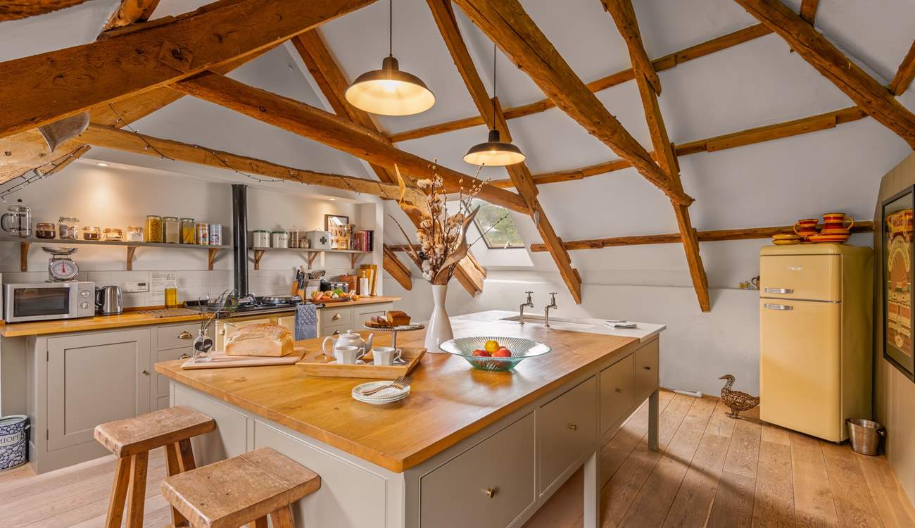 The fully equipped kitchen is such a light and spacious space to prepare any meal.