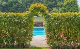 Step through the hedge to your privately enclosed swimming pool area. - Thumbnail Image