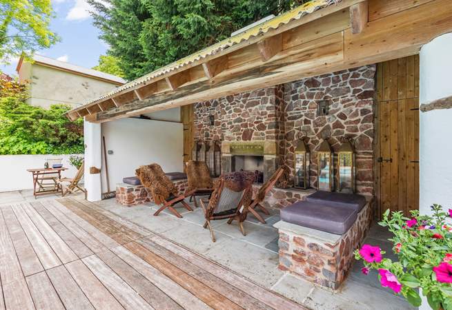 The enclosed outdoor area is perfect in the evening too. Spark up the open fire and enjoy a very different feel to this glorious area.