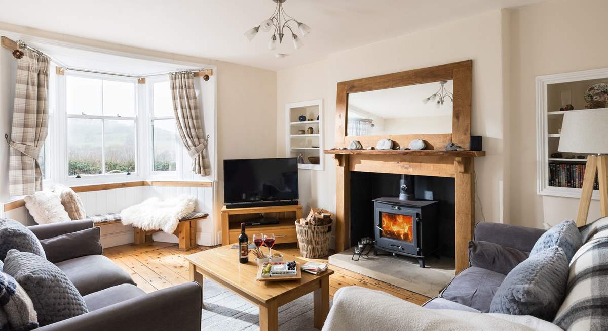 Cosy up in this delightful sitting-room.