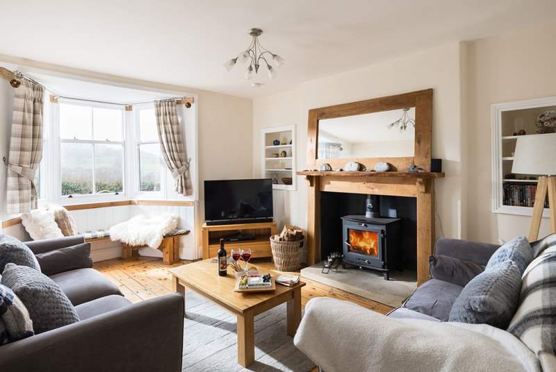 Cosy up in this delightful sitting-room.