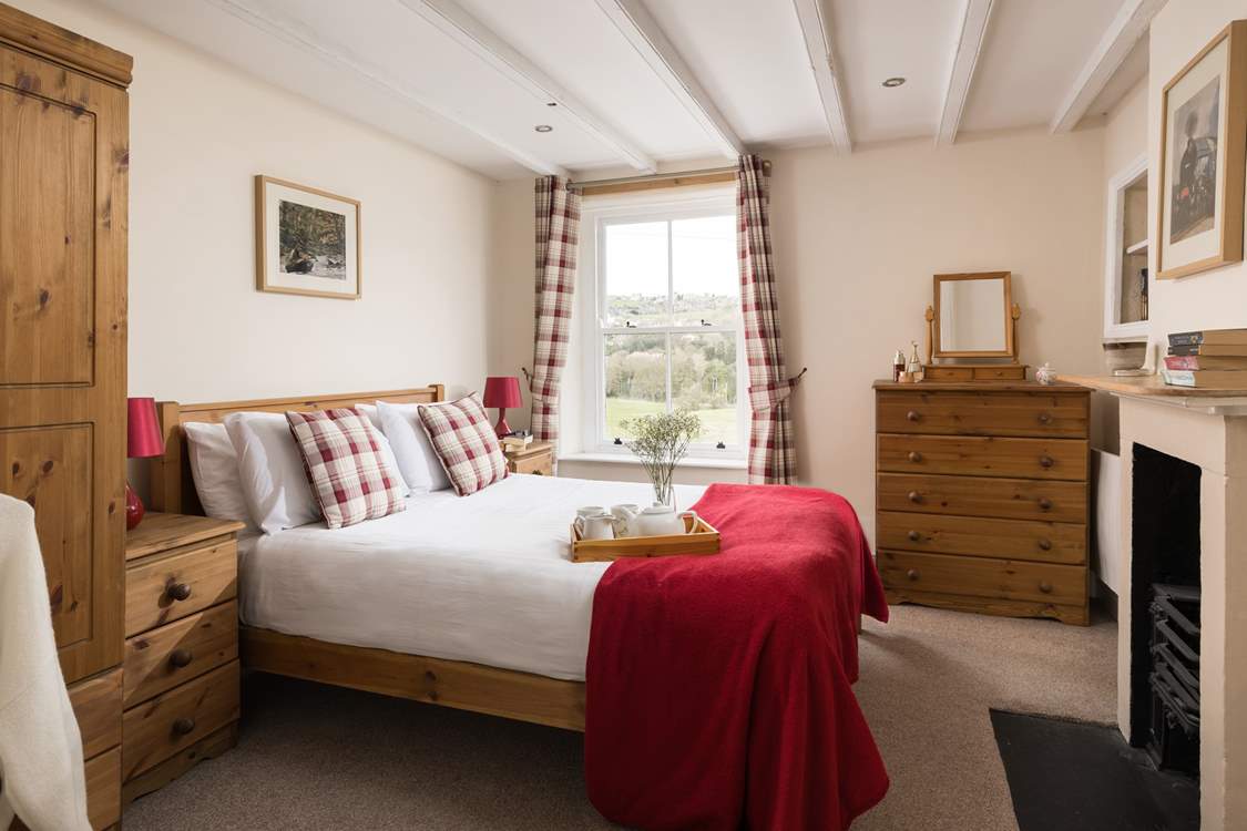 Retire to this beautiful bedroom with a view.