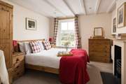 Retire to this beautiful bedroom with a view.