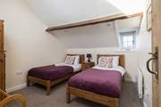 The spacious twin bedroom.